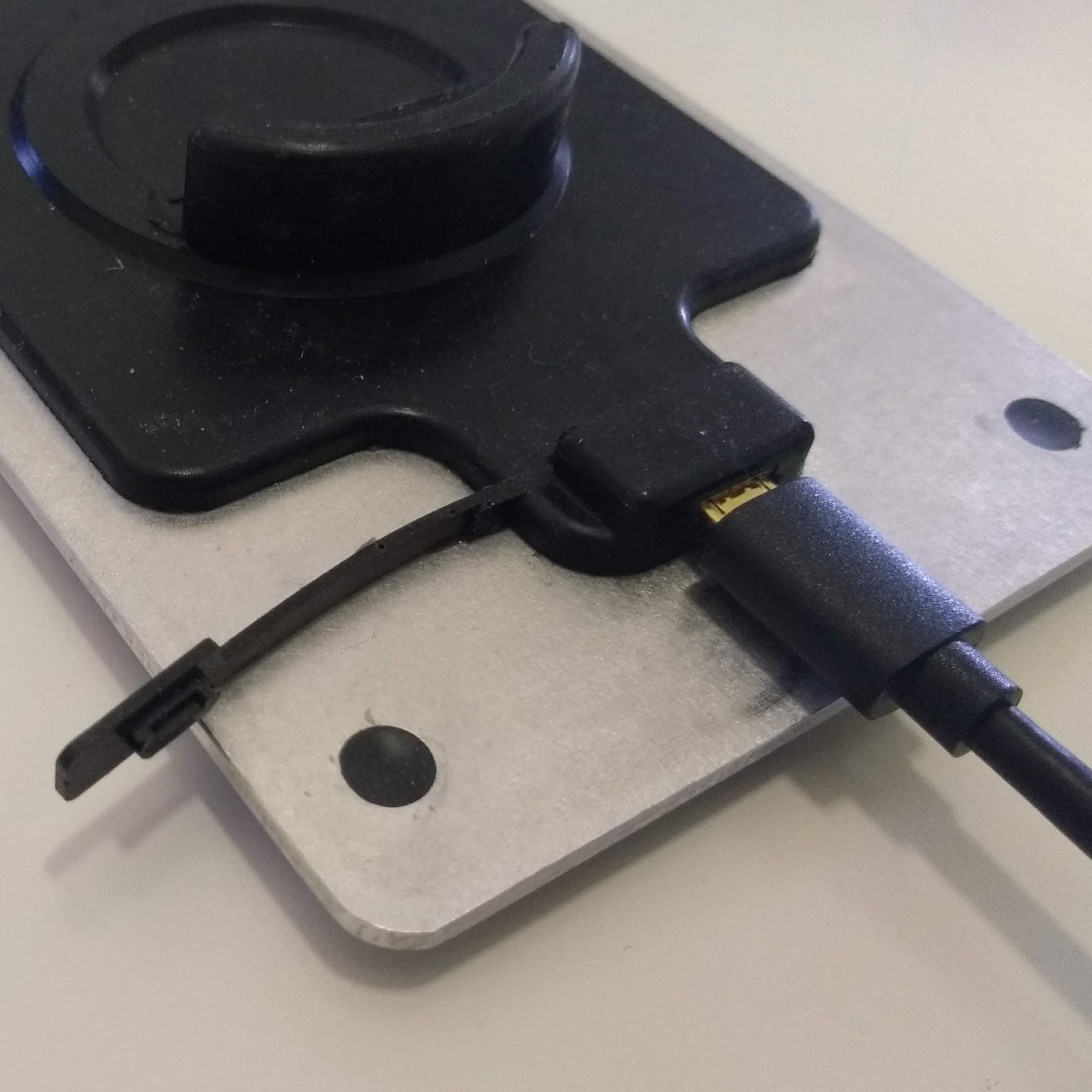 Old style solar panel plugged in to charge